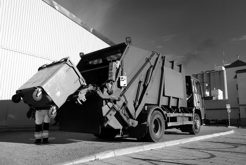 Professional waste removal team collecting business waste
